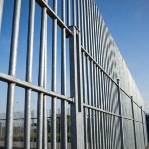 Industrial fencing installation showcasing steel palisade in an outdoor setting